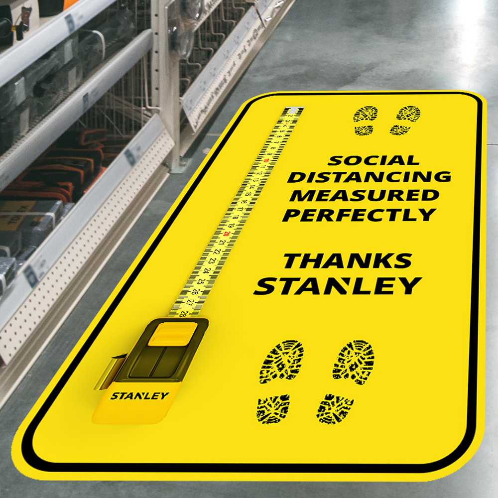 The future of floor graphics with Drytac; tape measure showing social distancing while still remaining true to its brand.